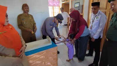 Kapolsek Botumoito Turut Dukung Kegiatan Pemberian Makanan Tambahan untuk Balita di Tapadaa