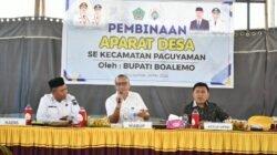 Di Hadapan Aparat Desa se kecamatan Paguyaman, Wabup Lahmuddin Tekankan Musyawarah dan Kekompakan